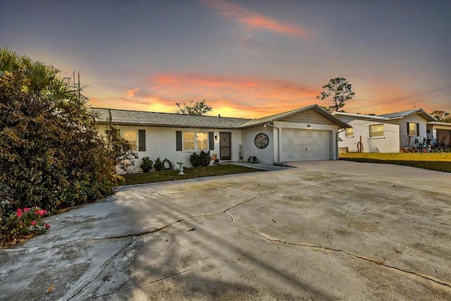 single story home featuring a garage