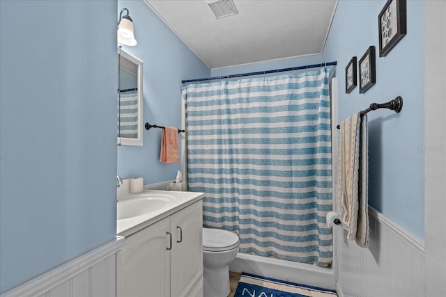 bathroom featuring vanity, toilet, and curtained shower