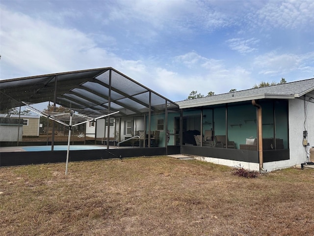 back of house featuring glass enclosure