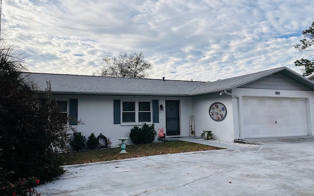 ranch-style house featuring a garage