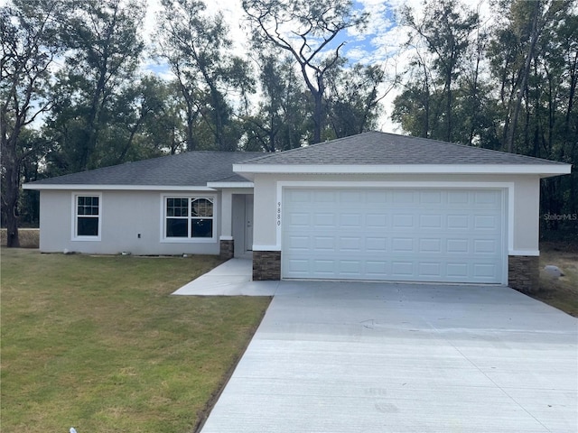 single story home with a front lawn and a garage