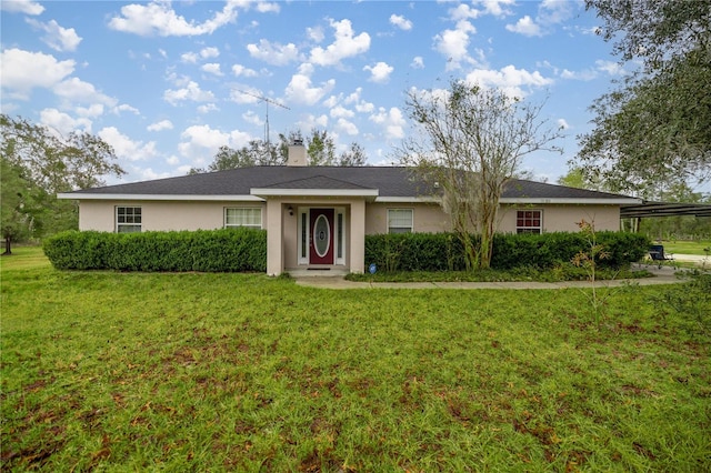 single story home featuring a front lawn