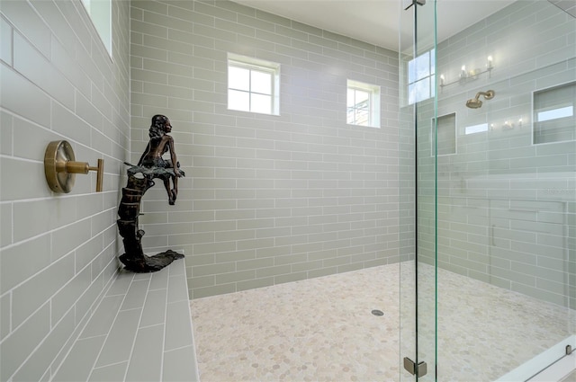 bathroom featuring tiled shower