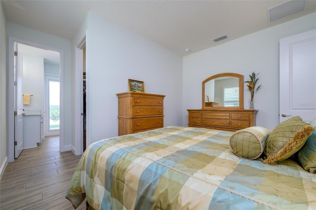 bedroom featuring hardwood / wood-style flooring