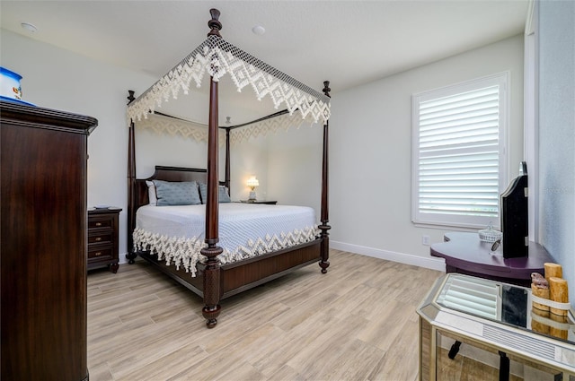 bedroom with light hardwood / wood-style flooring