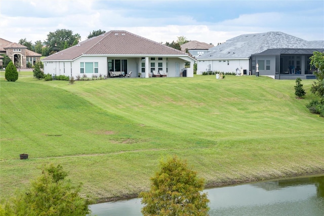 back of house with a yard