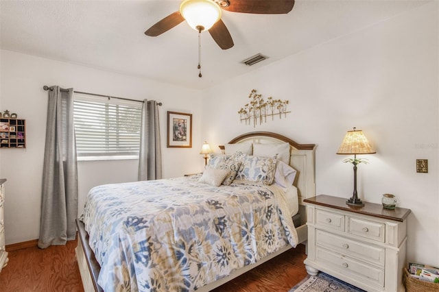 bedroom featuring ceiling fan and dark hardwood / wood-style flooring