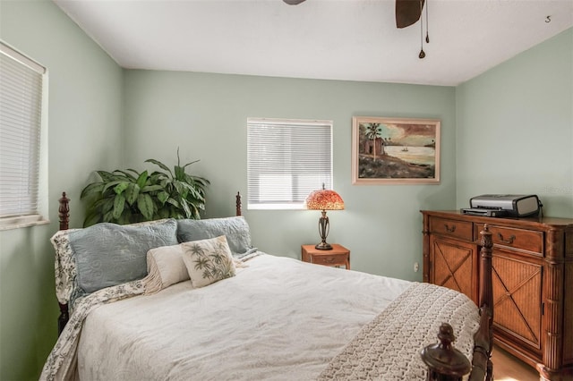 bedroom with hardwood / wood-style floors and ceiling fan