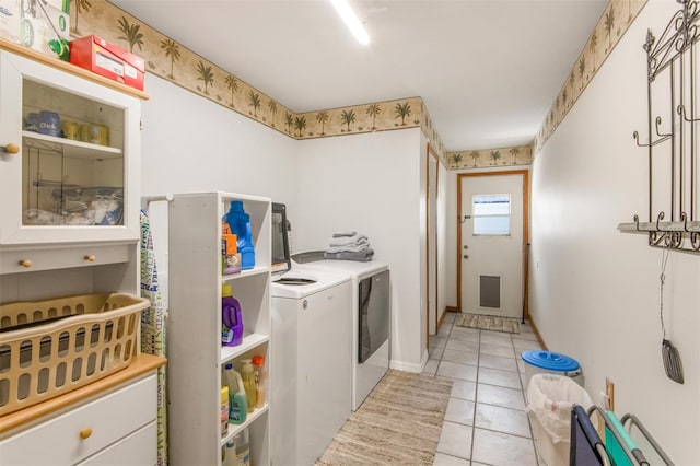 washroom with light tile patterned flooring and independent washer and dryer