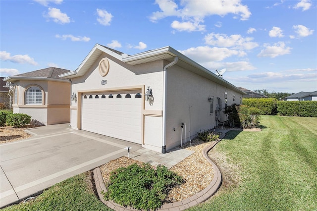 view of side of property with a garage and a lawn