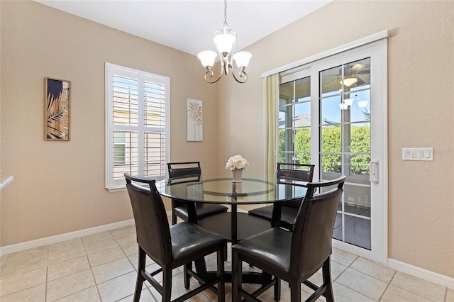 dining space featuring light tile patterned floors and a notable chandelier