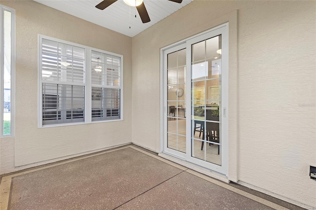 interior space featuring ceiling fan