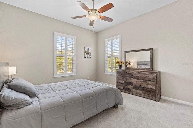 bedroom featuring ceiling fan and light colored carpet