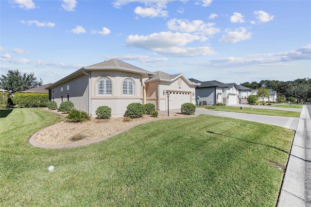 single story home featuring a garage and a front lawn