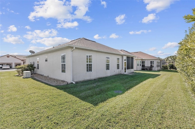 back of house featuring a lawn