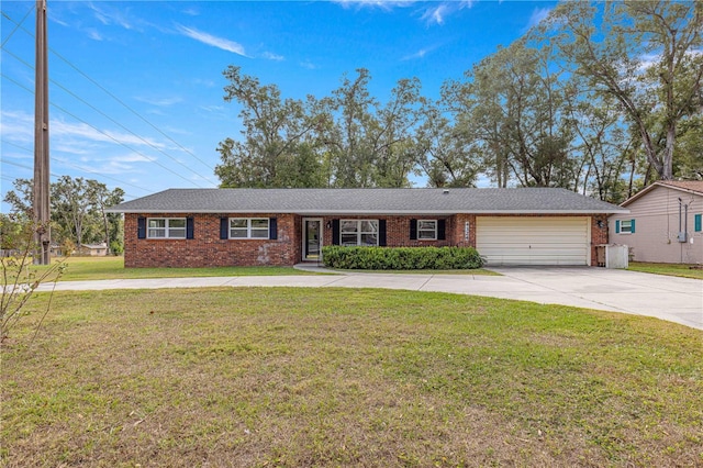 ranch-style home featuring a garage and a front lawn