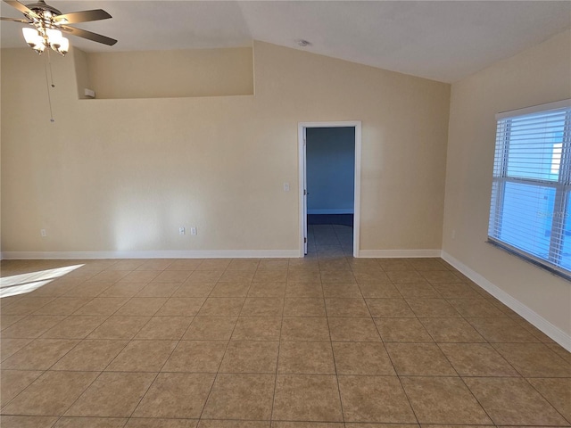 tiled spare room featuring ceiling fan and lofted ceiling