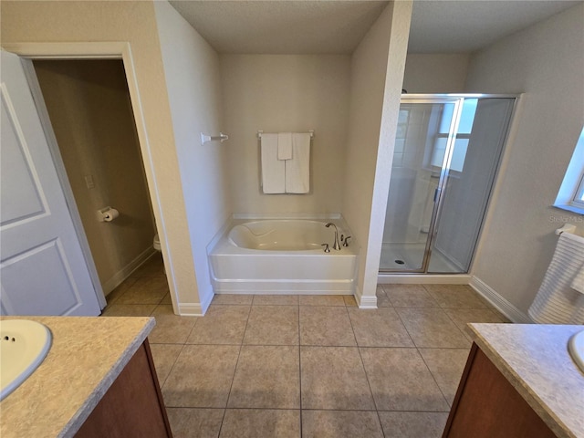 full bathroom featuring tile patterned floors, vanity, toilet, and separate shower and tub