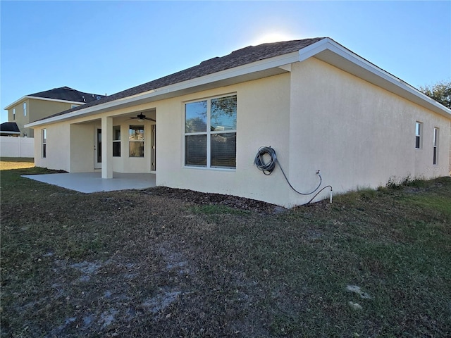 view of home's exterior with a patio and ceiling fan