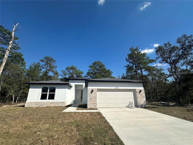 view of front facade featuring stucco siding, an attached garage, stone siding, driveway, and a front lawn