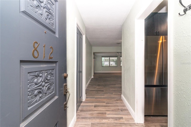 hall with dark hardwood / wood-style floors