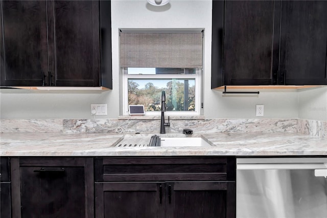 kitchen with sink, dark brown cabinetry, and stainless steel dishwasher