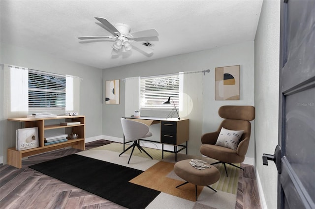 office area with ceiling fan, plenty of natural light, and a textured ceiling