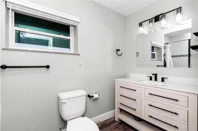 bathroom with a shower with curtain, toilet, and vanity