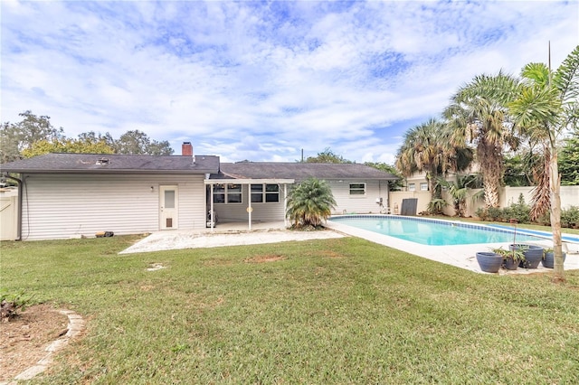 view of pool featuring a patio area and a lawn