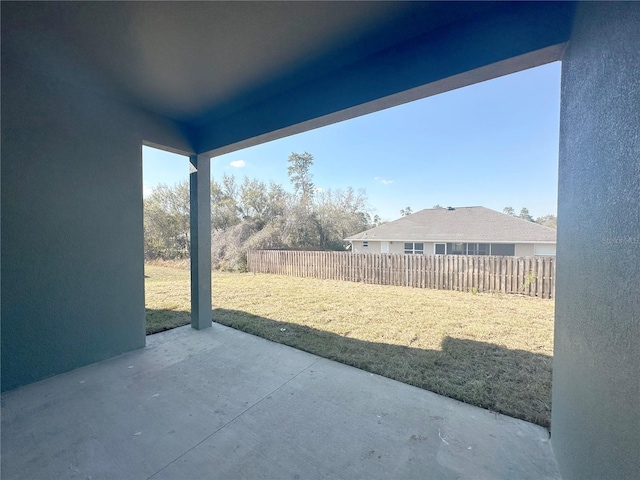 view of patio featuring fence