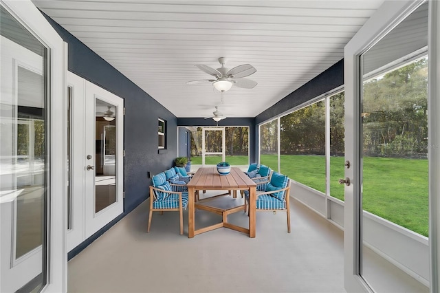 sunroom / solarium with a wealth of natural light and ceiling fan