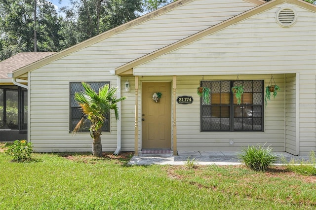 bungalow-style home featuring a front yard