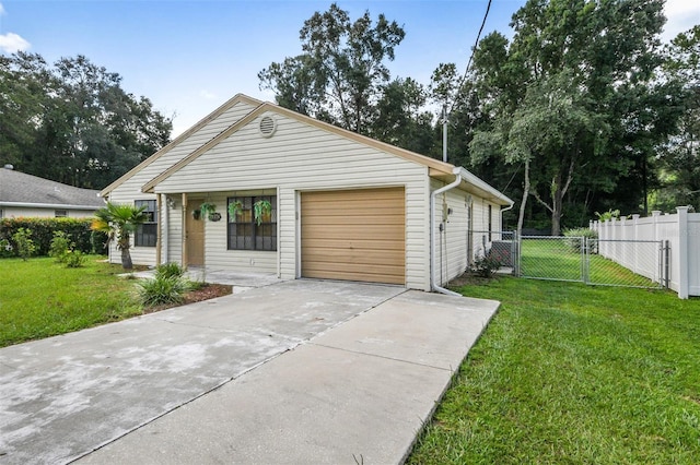 view of front of property featuring a garage and a front lawn