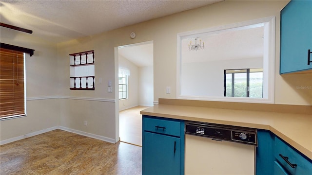 kitchen with dishwasher, a healthy amount of sunlight, and blue cabinets