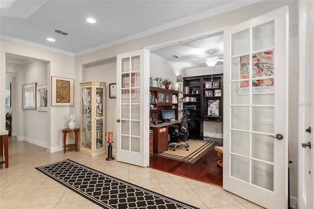 office space with french doors, light wood-type flooring, ceiling fan, and crown molding