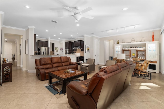 tiled living room featuring ceiling fan and ornamental molding