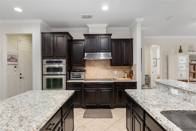 kitchen with stainless steel double oven, crown molding, black electric stovetop, light tile patterned floors, and dark brown cabinets