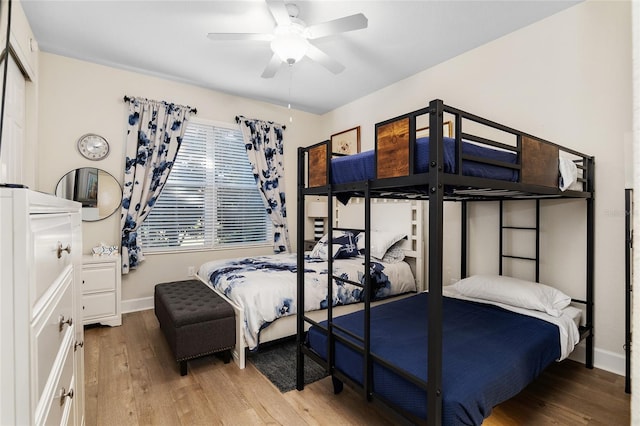 bedroom with hardwood / wood-style flooring and ceiling fan