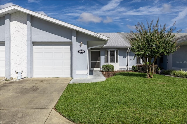 single story home featuring a front yard and a garage