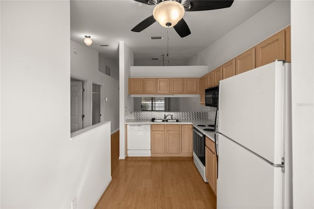 kitchen with light brown cabinets, white appliances, sink, and light hardwood / wood-style flooring