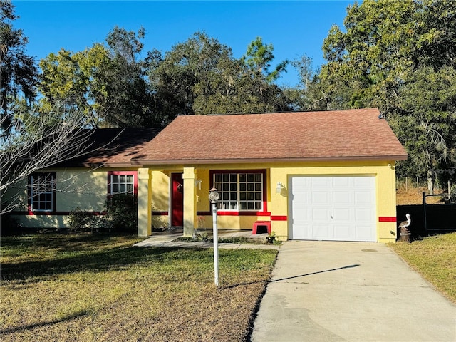 ranch-style house featuring a garage and a front yard