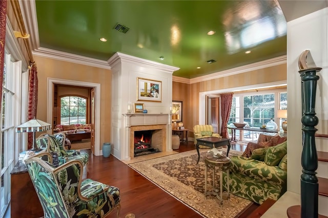 living room featuring dark hardwood / wood-style floors and ornamental molding