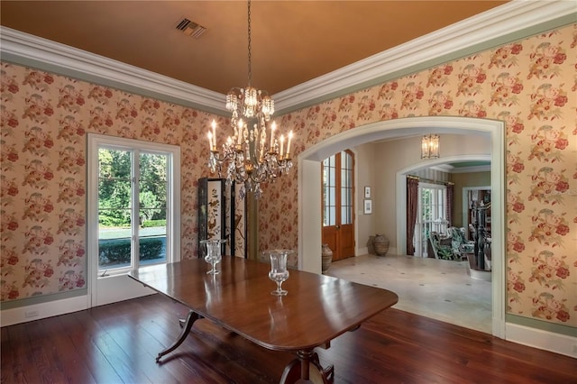 unfurnished dining area featuring crown molding and dark wood-type flooring