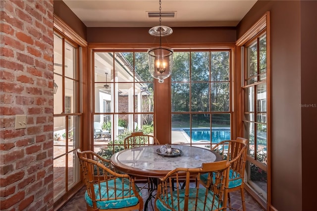 dining area with brick wall