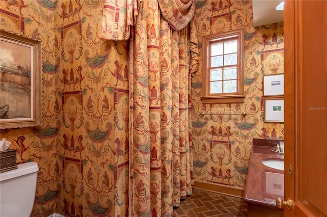 bathroom featuring vanity and toilet