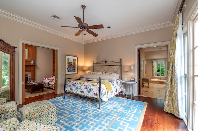 bedroom featuring multiple windows, ceiling fan, dark hardwood / wood-style flooring, and crown molding