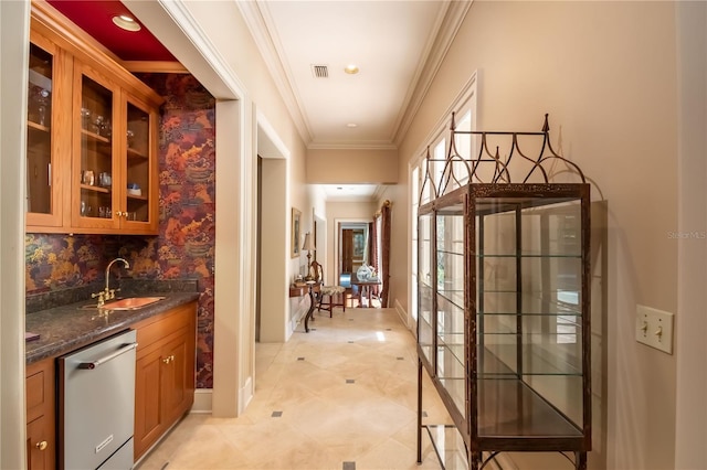 bar featuring dishwasher, dark stone counters, crown molding, sink, and tasteful backsplash