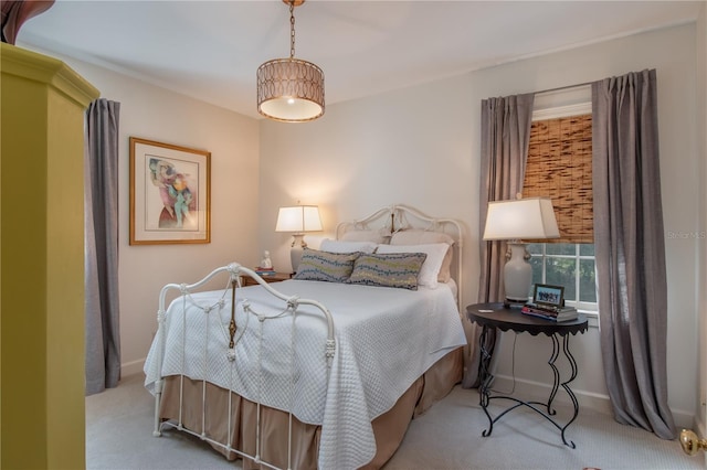 bedroom featuring light carpet