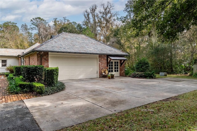 view of side of home featuring a garage