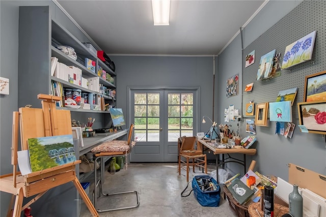 miscellaneous room featuring french doors, concrete floors, and ornamental molding